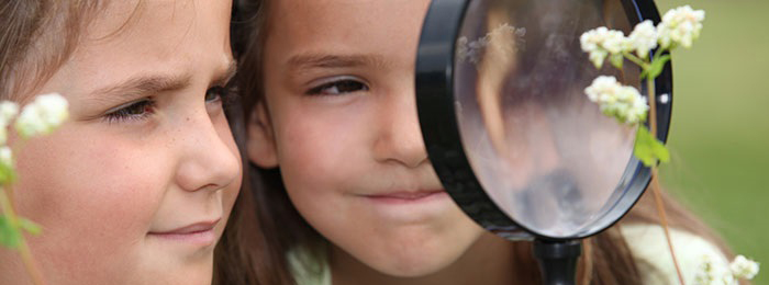 Children with Magnifying Glass